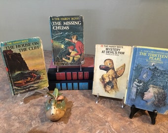 The Hardy Boys The House on the Cliff, Nancy Drew The Thirteenth Pearl, The Hardy Boys at Devil’s Paws, or The Missing Chums