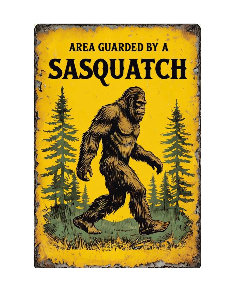 May include: A rectangular metal sign with a yellow background and a distressed, aged appearance. The sign features a brown Sasquatch illustration walking through a forest, with the text "AREA GUARDED BY A SASQUATCH" in black.