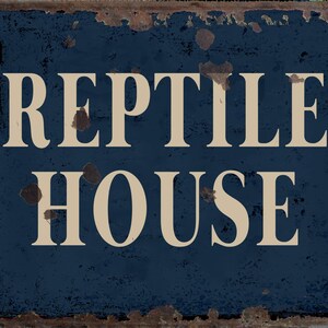 May include: A blue metal sign with the words "REPTILE HOUSE" in white lettering. The sign has a distressed, rusty look.