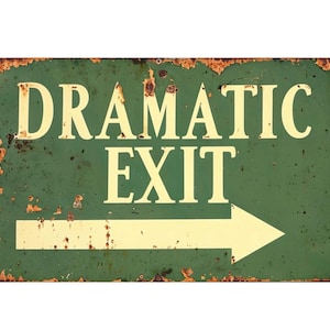 May include: A green metal sign with a white arrow pointing to the right. The sign reads "Dramatic Exit" in white letters.
