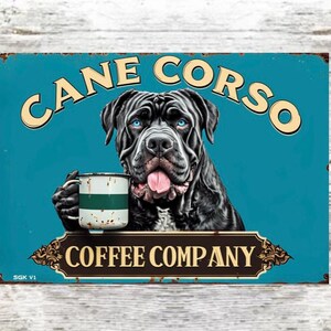 May include: A distressed metal sign featuring a black Cane Corso dog with blue eyes, holding a coffee mug. The sign reads "CANE CORSO" above the dog and "COFFEE COMPANY" below, in cream-colored lettering.