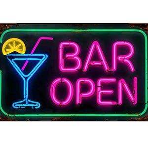 May include: A neon sign with a black background and a green border. The sign features a blue cocktail glass with a lemon slice, a pink straw, and the words "BAR OPEN" in pink neon.