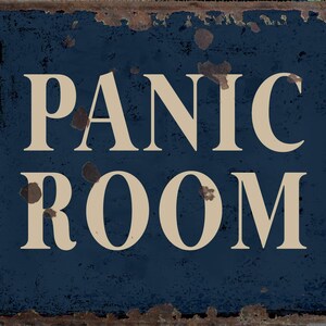 May include: A blue metal sign with rusty edges and white lettering that reads "PANIC ROOM".