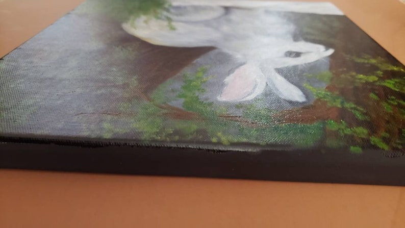 Hand painted oil winter scene of snowshoe rabbit