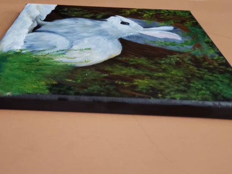 Hand painted oil winter scene of snowshoe rabbit