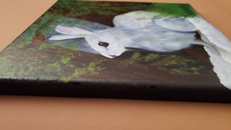 Hand painted oil winter scene of snowshoe rabbit