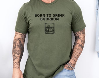 May include: A green t-shirt with the text "Born to Drink Bourbon" and a drawing of a glass of bourbon with ice cubes.