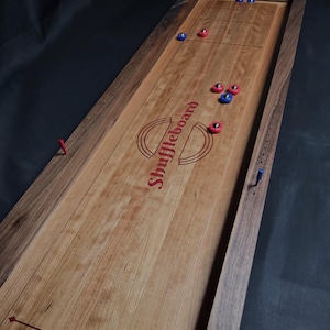 A unique 2-in-1 tabletop Shuffleboard & Curling Game.  Perfect for game night with friends and family!