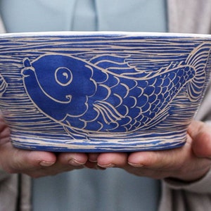 Handmade  bowl  20 oz,  ceramic pottery with blue and white fish illustration