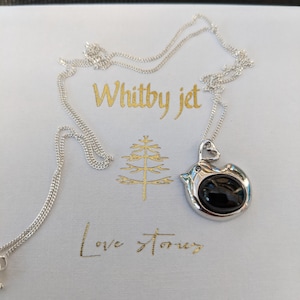 A 925 Sterling silver and Whitby Jet bird pendant