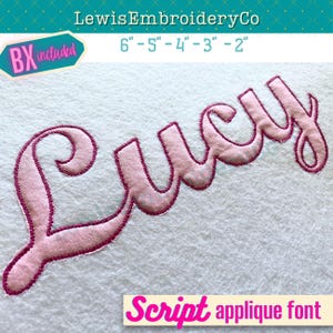 May include: Pink embroidered applique of the name "Lucy" in a script font. The applique is on a white fabric background. The text "6"-5"-4"-3"-2" and "Script applique font" are also visible in the image.