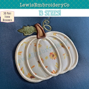 May include: White pumpkin with a brown stem and green leaves, embroidered with a floral pattern. The pumpkin is on a blue background. 3D Puff Foam Required. 13 Sizes!