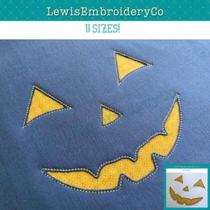 May include: A navy blue fabric with a yellow pumpkin face design. The pumpkin face includes triangular eyes and a curved mouth, all outlined with yellow stitching. The text "LewisEmbroideryCo" and "11 SIZES!" are at the top.