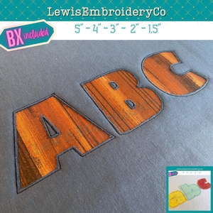 May include: Embroidered letters A, B, and C with a wood grain pattern, outlined in dark blue. The letters are in varying sizes, with the largest being 5 inches. The image includes the text "LewisEmbroideryCo" and "BX included".
