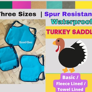 May include: Three sizes of turquoise blue waterproof turkey saddles with black trim and colorful buttons. The saddles are made by Rose & Bees and are spur resistant. The saddles are available in basic, fleece lined, and towel lined options.