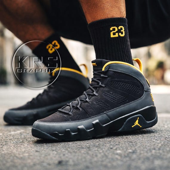 university gold jordans 9