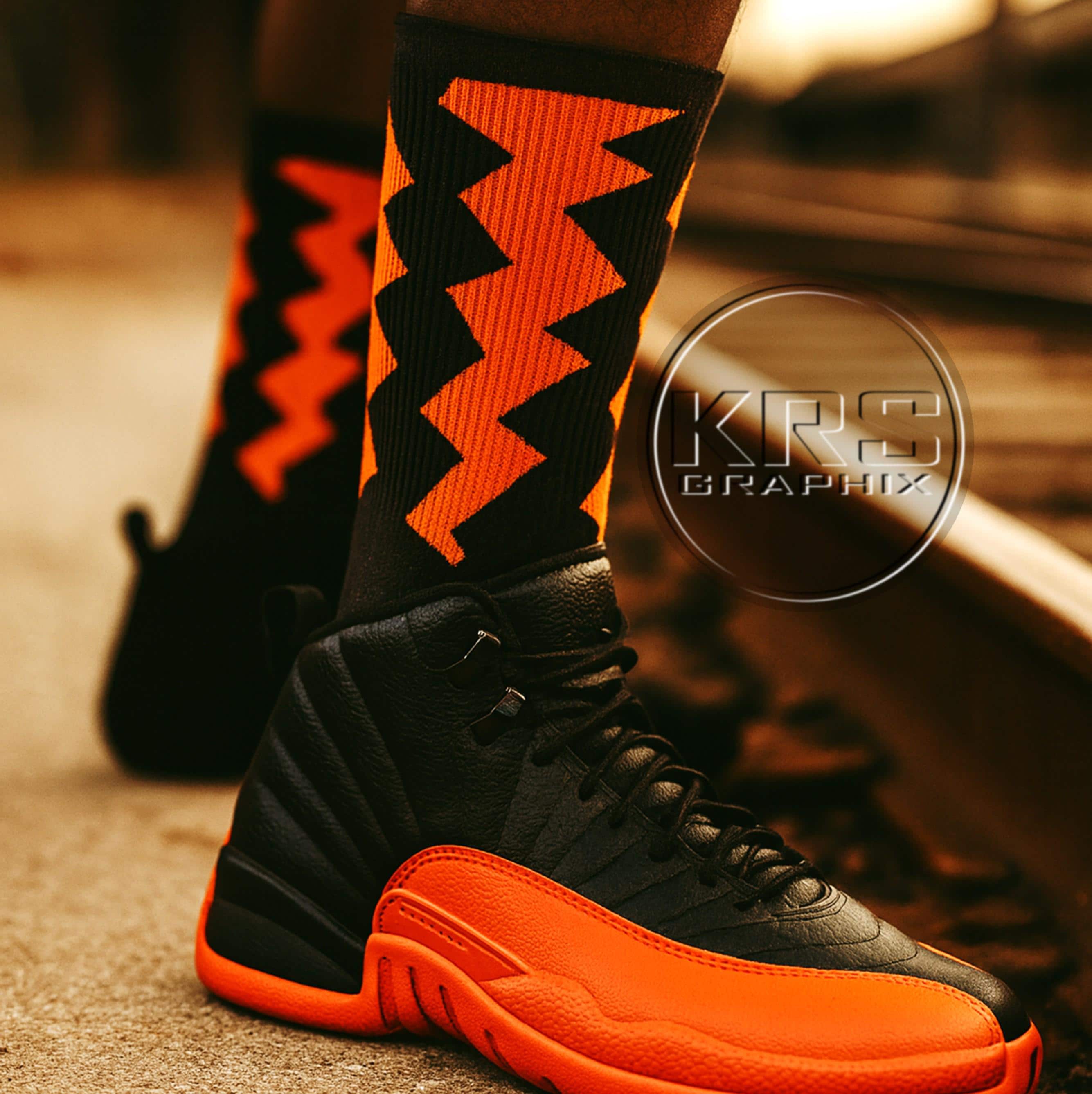 jordan 12s black and orange