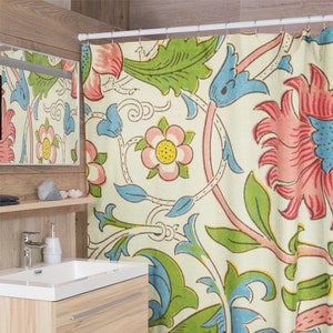May include: A shower curtain featuring a floral design in shades of pink, blue, green and yellow on a cream background. The pattern includes stylised flowers and leaves.
