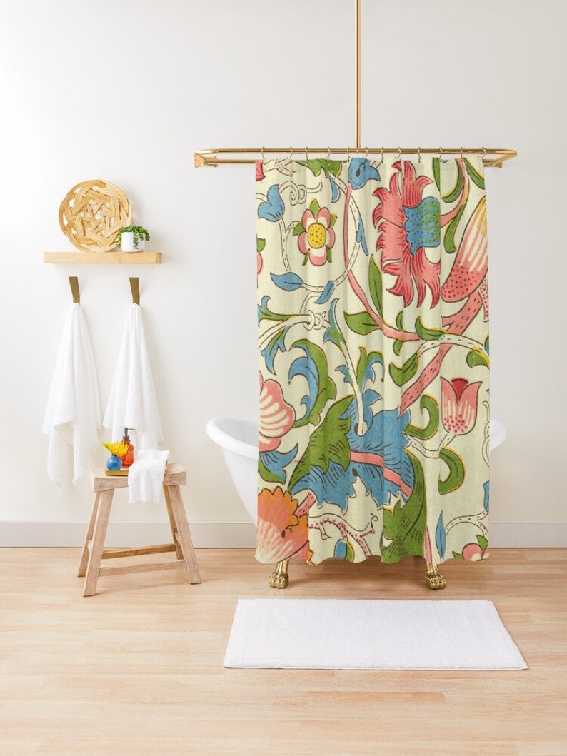 May include: A shower curtain featuring a vintage floral pattern with pink, blue, and green flowers on a cream background.