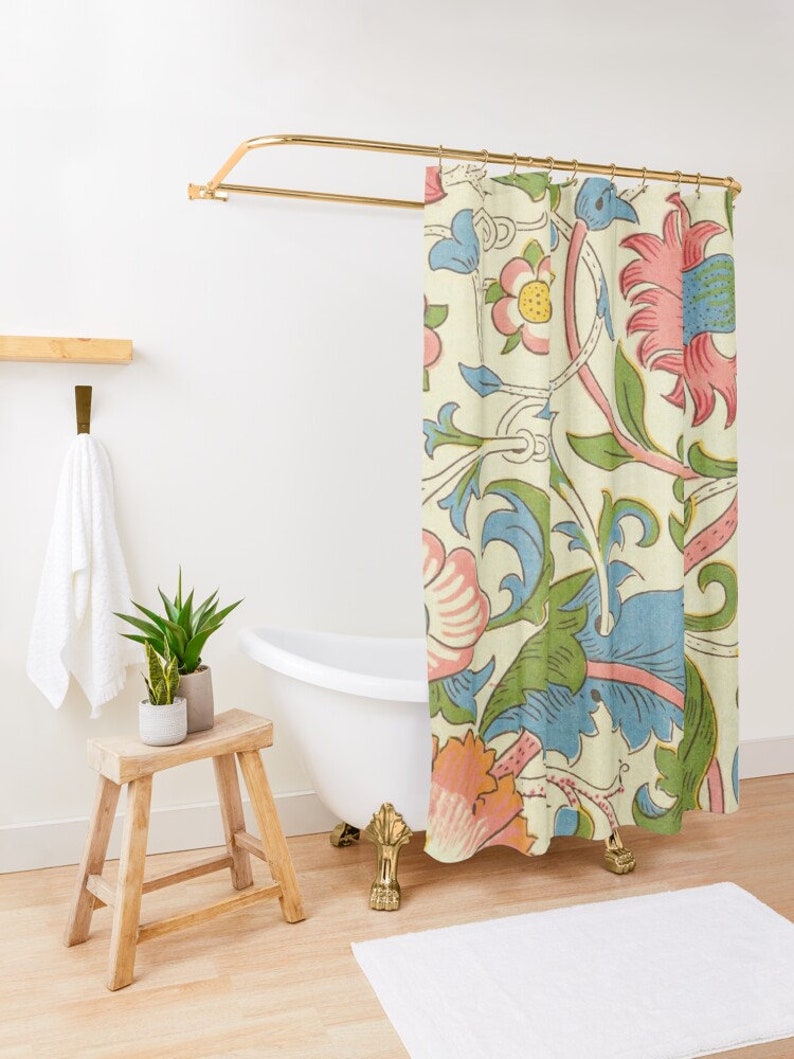 May include: A shower curtain featuring a vintage floral design in shades of pink, blue and green on a cream background.