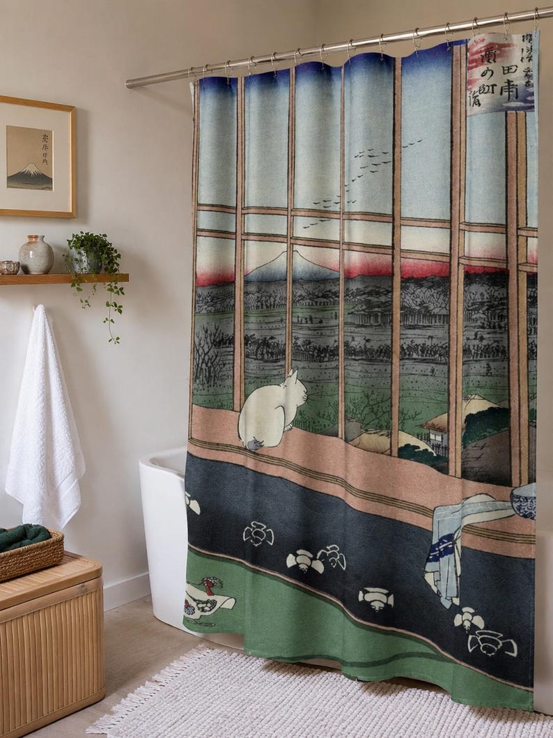 May include: A shower curtain featuring a Japanese woodblock print style illustration of a white cat sitting on a wooden ledge looking out a window at a landscape with a mountain, birds, and trees, with Japanese text in the upper right corner.