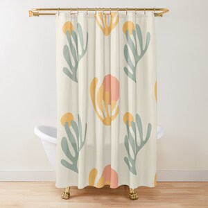 May include: A shower curtain with a repeating pattern of stylized flowers in shades of yellow, pink, and green on a cream background.