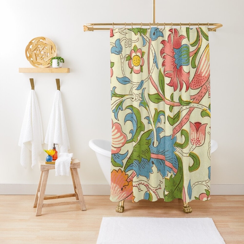 May include: A shower curtain featuring a vintage floral pattern with pink, blue, and green flowers on a cream background.