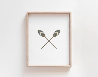 May include: A framed print of two wooden oars with blue and brown chevron patterns, crossed in the center.