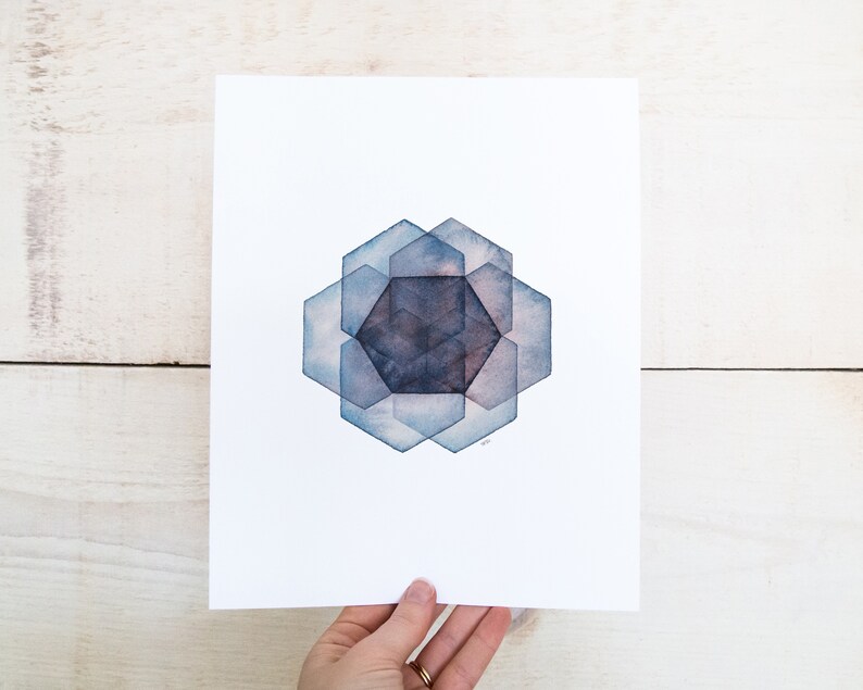May include: A watercolor painting of a geometric design with overlapping hexagons in shades of blue and gray.