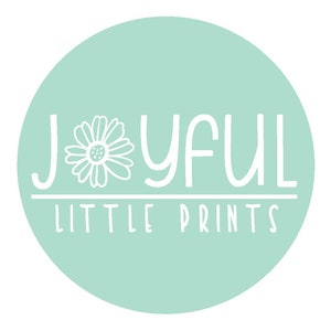 May include: A round, light teal graphic with the words "JOYFUL LITTLE PRINTS" in white, stylized font. A white daisy graphic is on the left side of the word "JOYFUL".