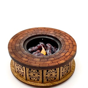 May include: A miniature wooden fire pit with a brick-like design and a decorative base. The fire pit has a small flame and faux logs inside.
