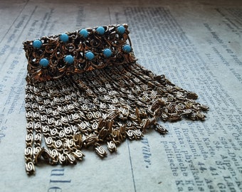 Vintage antique gold colored brooch, prong set seed beads faux turquoise, greek key style chain fringe