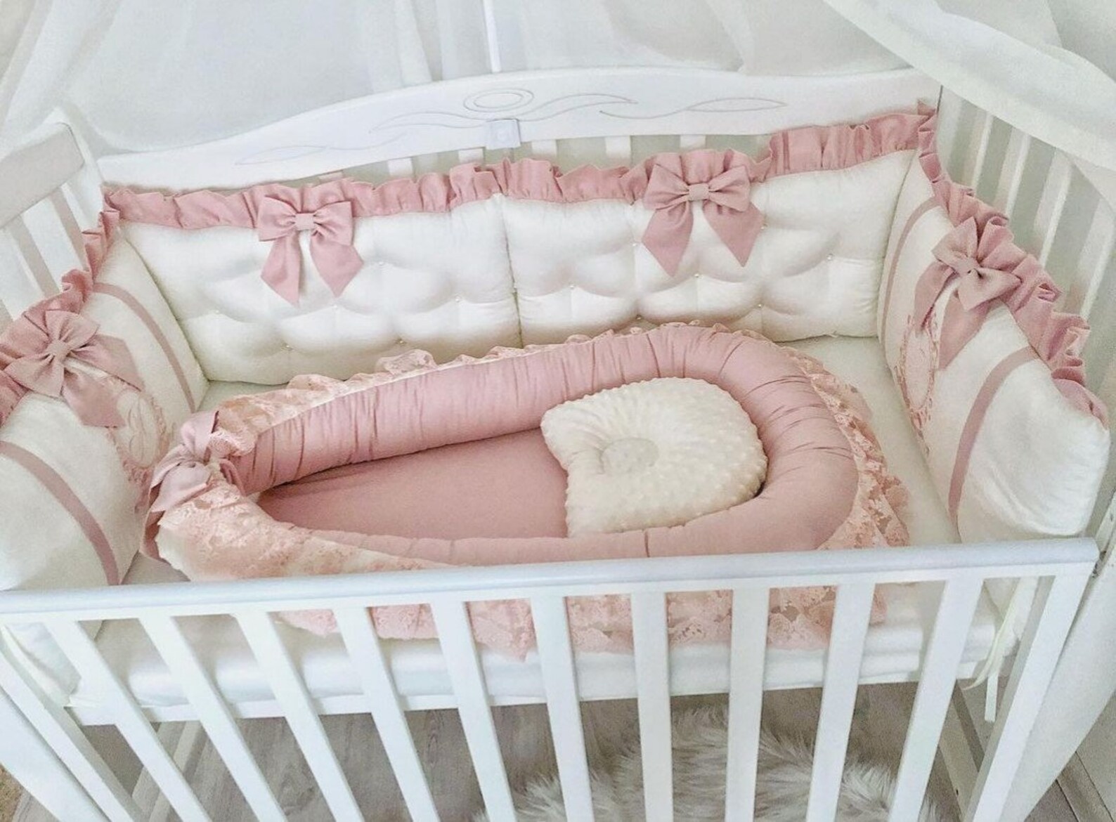 pink baby crib with mattress