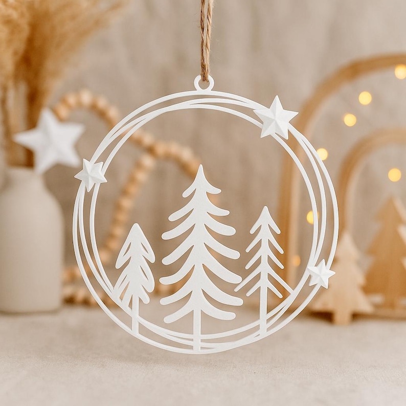 3D printable wreath STL file layered pine trees inside a circular frame with stars for Christmas or winter holiday decoration