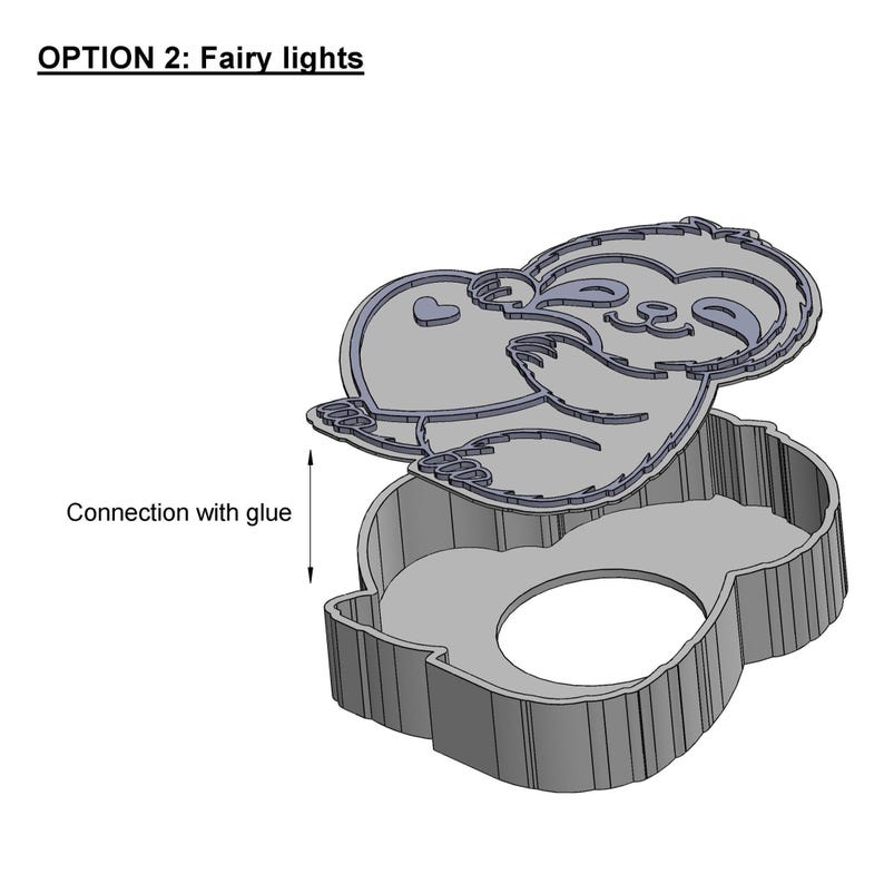 May include: A gray, 3D-printed sloth-shaped container with a lid. The lid features a sloth design with a heart and the text "OPTION 2: Fairy lights". The container is designed for fairy lights and is assembled with glue.