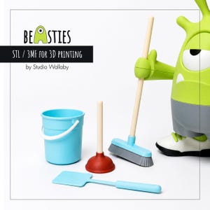 May include: A collection of 3D-printed toys, including a light blue bucket, a red plunger, a light blue dustpan, and a light blue and gray broom. A green monster figure is holding the broom. The text "BEASTIES" and "STL / 3MF FOR 3D PRINTING" are visible.