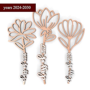 May include: Three wooden flower-shaped ornaments with the text "Class of 2024", "Class of 2027", and "Class of 2030" on each. The ornaments are for the years 2024-2030.