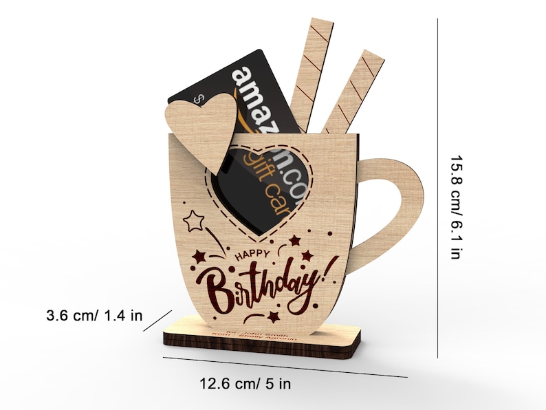 May include: Wooden mug shaped gift holder with a heart cutout and the words "Happy Birthday!"  The mug is 6.1 inches tall and 5 inches wide.  A gift card is shown inside the mug.