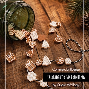 May include: A collection of small, brown and white holiday-themed beads shaped like gifts, snowflakes, trees, and bells, spilling from a green glass jar. Some beads are strung on black and white twine. Text reads: Commercial license 14 BEADS FOR 3D PRINTING by Studio Wallaby.