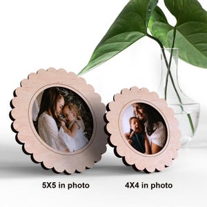 May include: Two wooden picture frames with scalloped edges. The larger frame is 5x5 inches and the smaller frame is 4x4 inches. Both frames are light brown and have a natural wood finish.