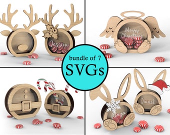 Op de afbeelding: Een bundel van zeven SVG-bestanden voor het maken van kerst-snoepdozen. De ontwerpen omvatten een rendier, een engel en een konijn. Elke doos heeft een transparant venster om snoep te tonen. De ontwerpen zijn perfect om een ​​persoonlijke touch toe te voegen aan kerstcadeaus.