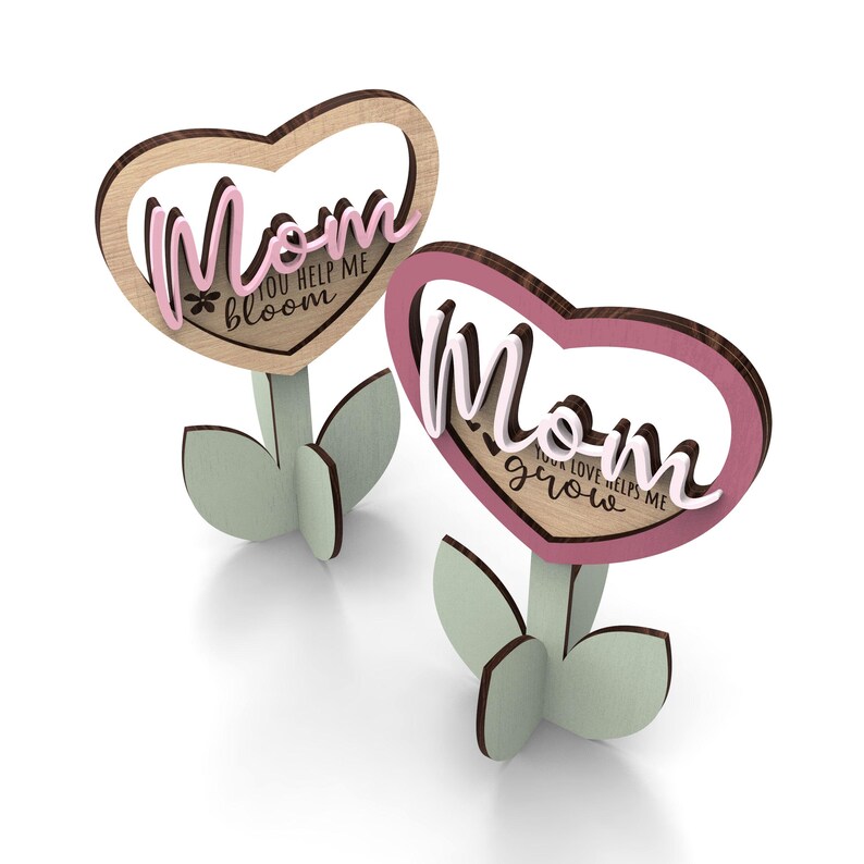 Mother’s Day flower sign SVG laser cut file showing two assembled mom heart stand designs with layered lettering