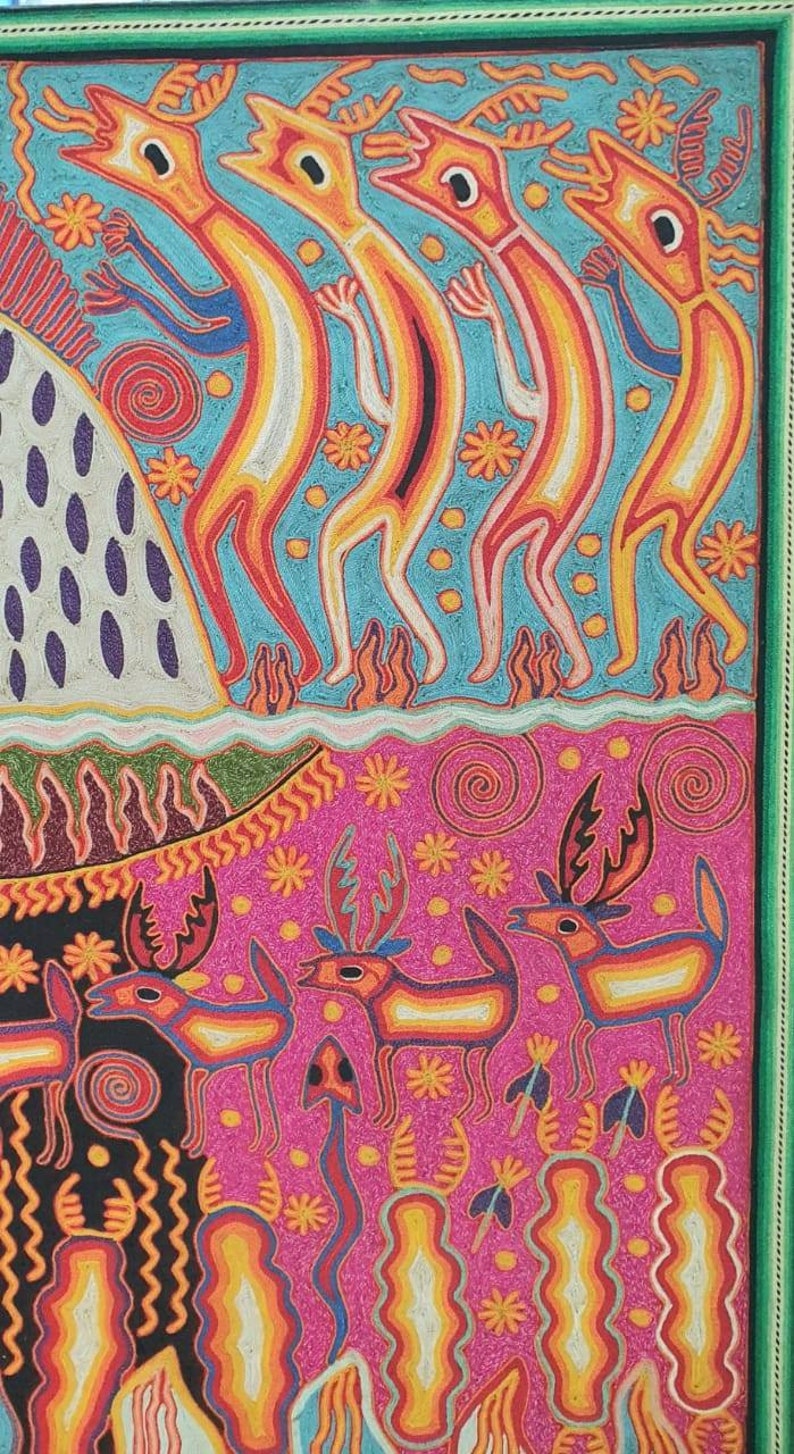 May include: A colorful, hand-stitched artwork depicting a scene with stylized figures. The top portion features four figures with long necks and antlers, standing on a blue background with white and yellow accents. The bottom portion features a pink background with stylized deer and plants.