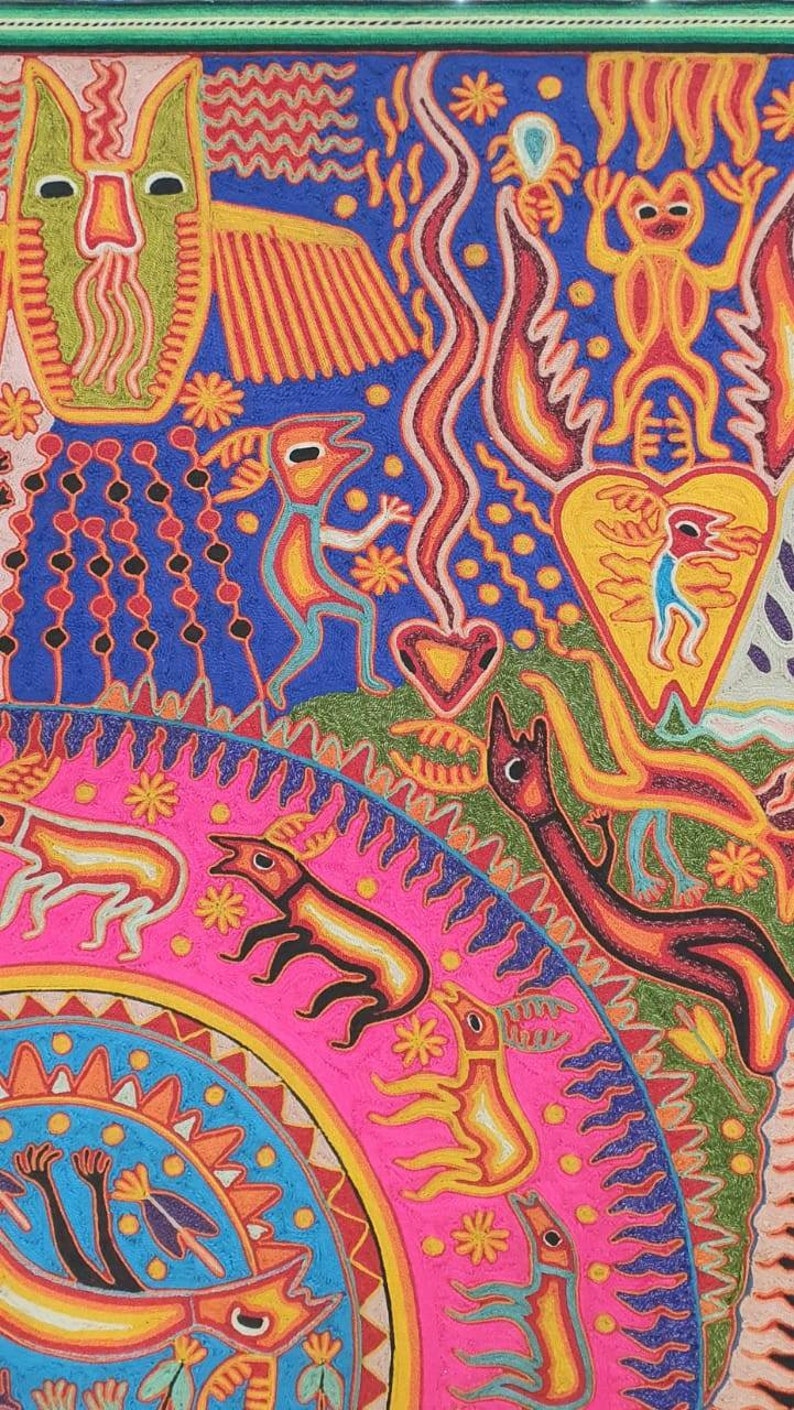 May include: A colorful, intricate artwork featuring a variety of animal figures, including a bird, a lizard, and a deer. The artwork is created using a technique that involves stitching together small pieces of yarn or thread. The background is a vibrant blue, and the figures are outlined in black.