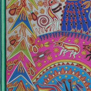 May include: A colorful, hand-stitched artwork depicting a variety of animals and plants. The artwork features a green owl with a yellow beak, a red and yellow bird, a pink and white deer, and a blue and yellow fish. The artwork is framed in a green frame.