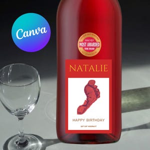 May include: A bottle of red wine with a custom label reading "Natalie" and "Happy Birthday", featuring a red footprint graphic. A wine glass is to the left. The bottle has a "Most Awarded Wine Brand" seal. The Canva logo is in the top left.
