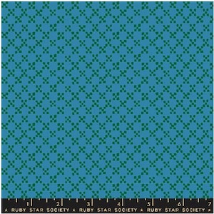 May include: Blue fabric with a repeating pattern of small green squares. The pattern creates a grid-like design. The bottom of the image has a ruler with the text "RUBY STAR SOCIETY".