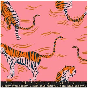 May include: A pink fabric featuring a repeating pattern of orange and black tigers with long tails. The design includes abstract orange wavy lines throughout. A black ruler with white markings and the text Ruby Star Society is at the bottom.