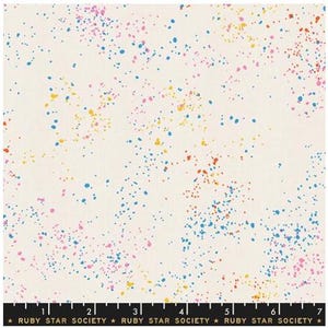 May include: Off-white fabric with a colorful splatter pattern. The design features small, irregular dots in shades of blue, pink, yellow, and orange scattered across the surface. The text "RUBY STAR SOCIETY" is printed along the bottom edge.