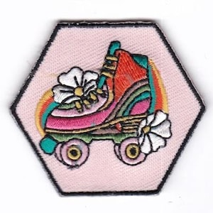 May include: A pink hexagonal patch with a colorful roller skate with rainbow accents and white flowers. The skate has green wheels and a pink, red, and green design.